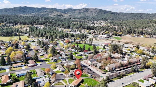 aerial view featuring a mountain view and a wooded view