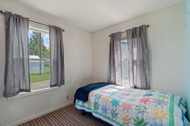 carpeted bedroom featuring baseboards