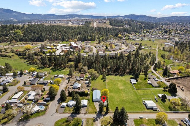 drone / aerial view with a mountain view and a residential view