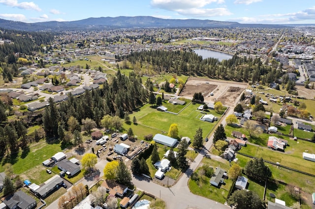 bird's eye view with a water and mountain view and a residential view