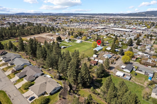 drone / aerial view featuring a mountain view and a residential view