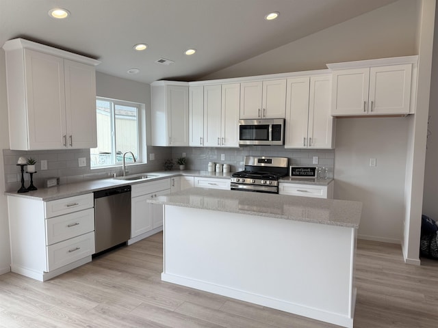 9520 E Michielli Ln, Spokane Valley, WA 99206 - kitchen with appliances with stainless steel finishes, a sink, a kitchen island, white cabinets, and recessed lighting