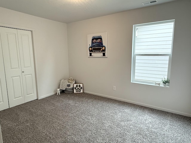 9520 E Michielli Ln, Spokane Valley, WA 99206 - unfurnished bedroom featuring carpet floors, baseboards, and a closet