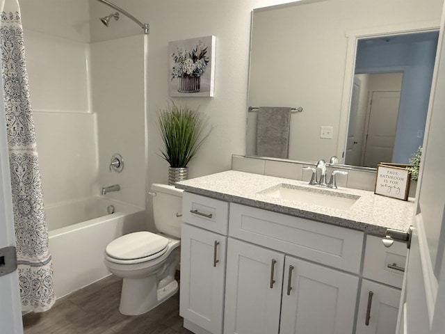 full bathroom featuring vanity, wood finished floors, shower / bathtub combination with curtain, and toilet