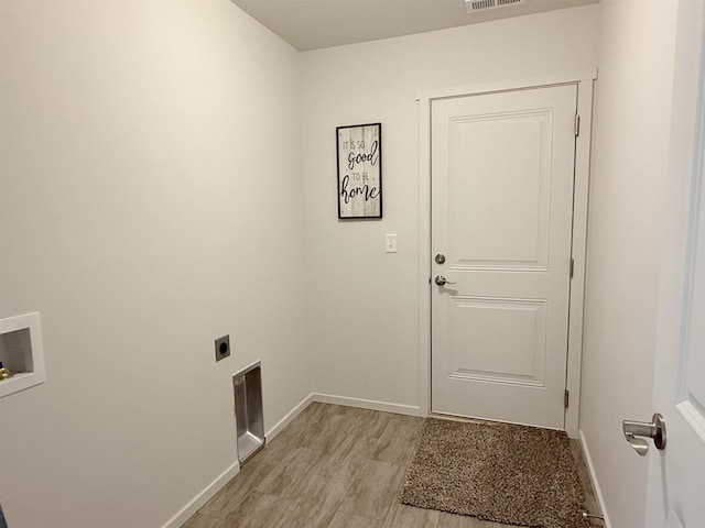 clothes washing area featuring laundry area, visible vents, hookup for an electric dryer, baseboards, and washer hookup