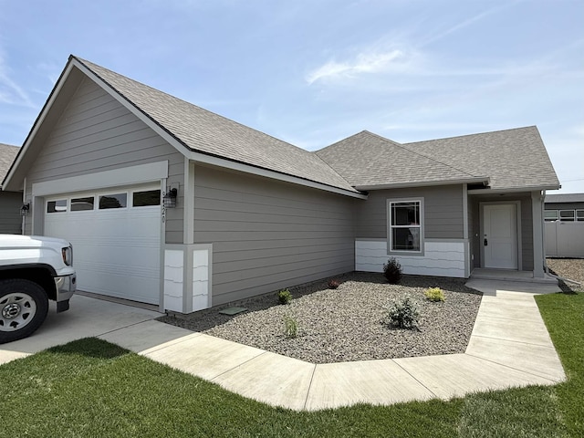 9520 E Michielli Ln, Spokane Valley, WA 99206 - view of front of home with an attached garage, roof with shingles, and driveway