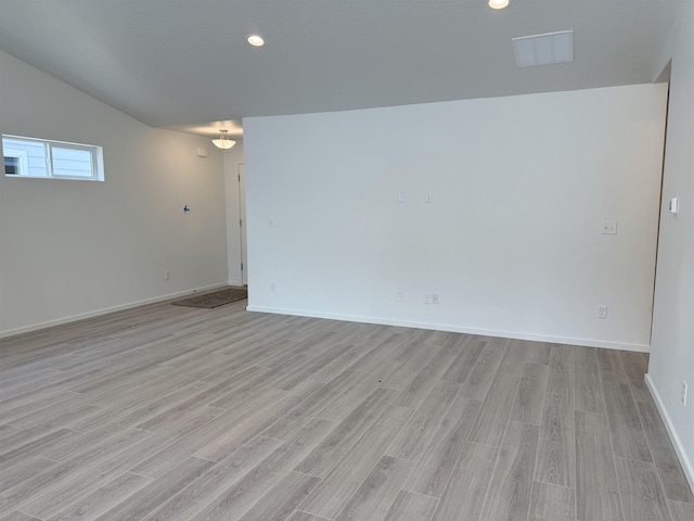 9520 E Michielli Ln, Spokane Valley, WA 99206 - spare room with light wood finished floors, vaulted ceiling, and recessed lighting