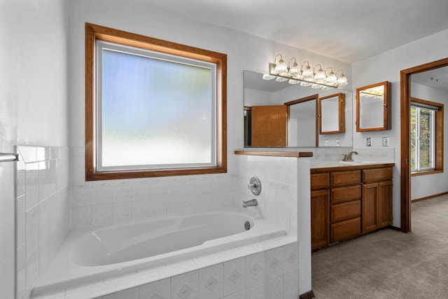 bathroom with a bath and vanity