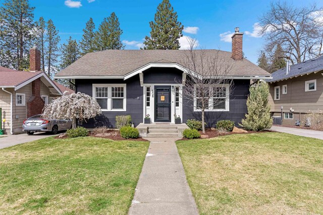 808 W 25th Ave, Spokane, WA 99203 - bungalow-style house with a front lawn, a chimney, and a shingled roof