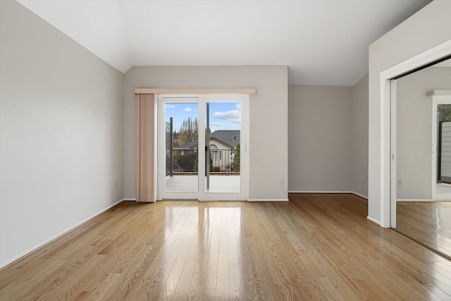 9701 W Masters Ln, Cheney, WA 99004 - unfurnished room featuring light wood-type flooring, healthy amount of natural light, and lofted ceiling