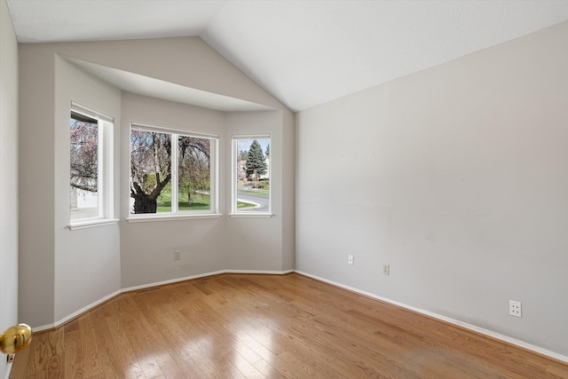 9701 W Masters Ln, Cheney, WA 99004 - empty room featuring wood finished floors and vaulted ceiling