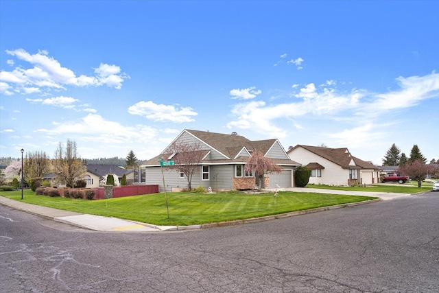 9701 W Masters Ln, Cheney, WA 99004 - view of front facade with an attached garage, asphalt driveway, and a front yard