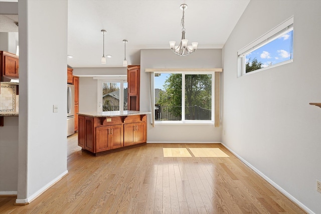 9701 W Masters Ln, Cheney, WA 99004 - kitchen with freestanding refrigerator, a chandelier, light wood-style flooring, plenty of natural light, and recessed lighting