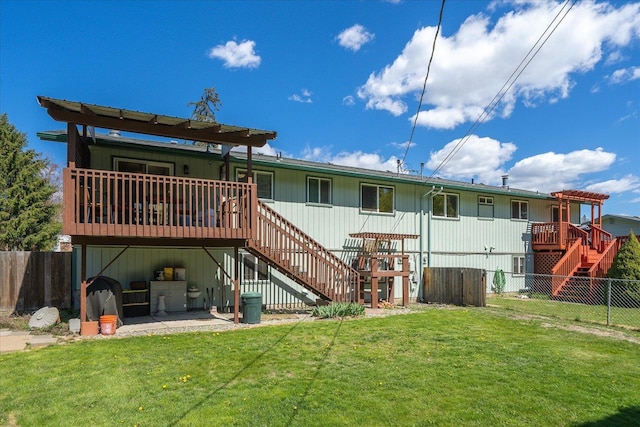 rear view of property with a wooden deck, a lawn, a fenced backyard, and stairway