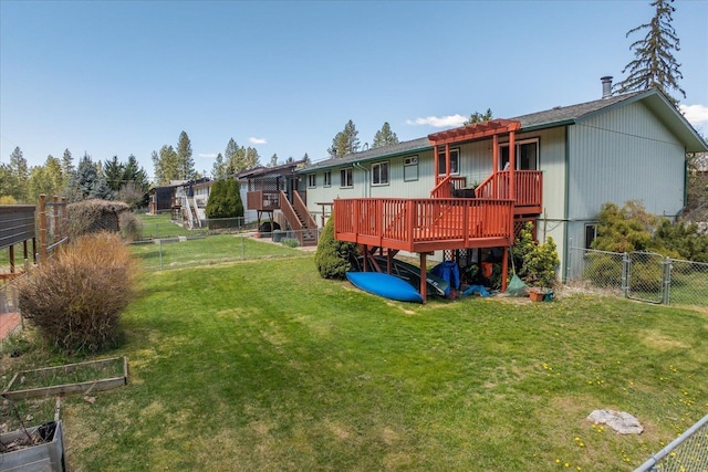 rear view of property with a fenced backyard, a yard, a deck, and stairs