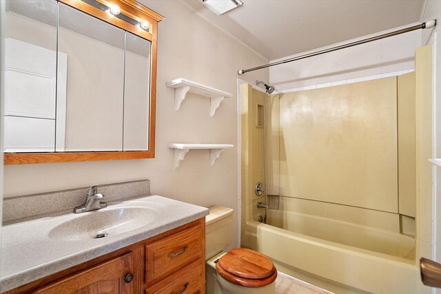 bathroom with vanity, toilet, and shower / washtub combination