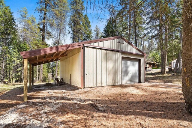 garage featuring a garage and driveway