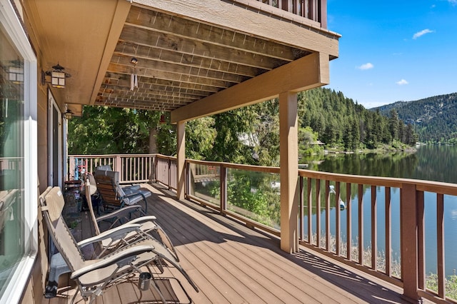 2876 Deep Lake S Shore Rd, Colville, WA 99114 - wooden deck with a water and mountain view and a view of trees