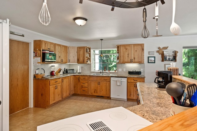 kitchen with a sink, stainless steel microwave, tasteful backsplash, open shelves, and dishwasher
