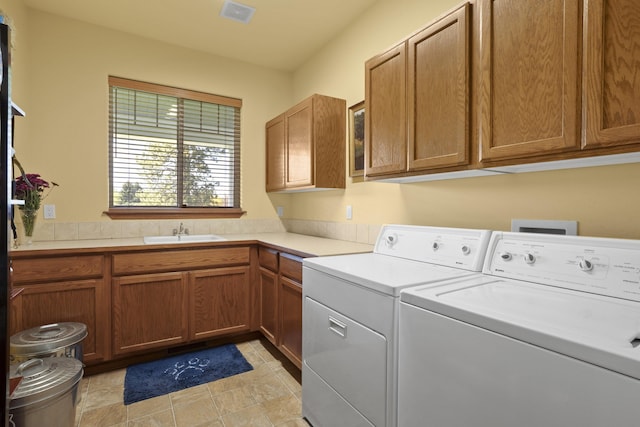 4127 S Sullivan Rd, Veradale, WA 99037 - laundry room featuring cabinet space, independent washer and dryer, visible vents, and a sink