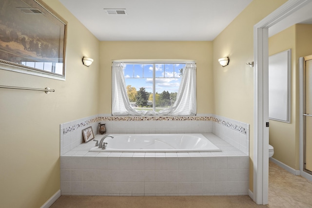 4127 S Sullivan Rd, Veradale, WA 99037 - bathroom featuring visible vents, toilet, a garden tub, and a healthy amount of sunlight