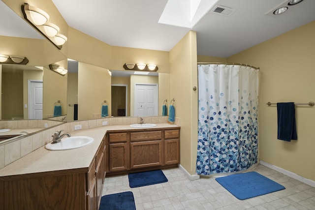 4127 S Sullivan Rd, Veradale, WA 99037 - full bath with baseboards, a sink, and double vanity