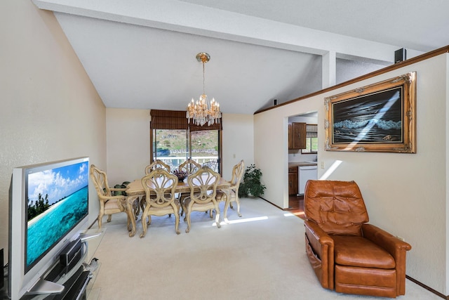 carpeted dining room with vaulted ceiling, a notable chandelier, and plenty of natural light