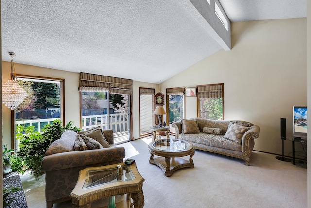 living area featuring carpet floors, a textured ceiling, and lofted ceiling with beams