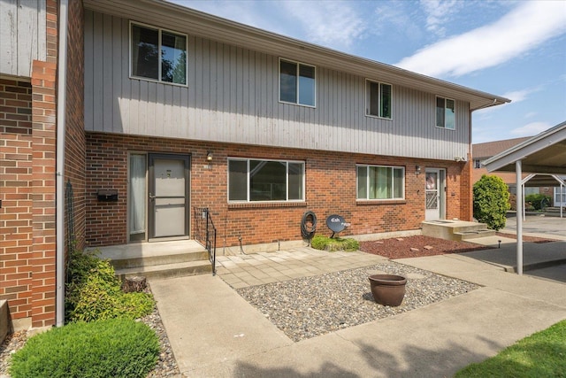 view of property featuring brick siding