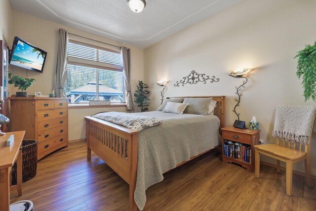 bedroom featuring wood finished floors