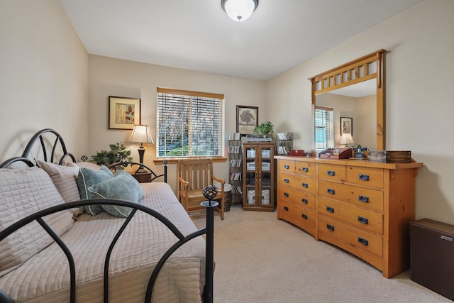 bedroom with light colored carpet