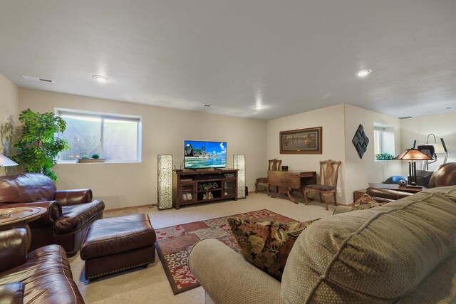 living area featuring baseboards, carpet flooring, and recessed lighting