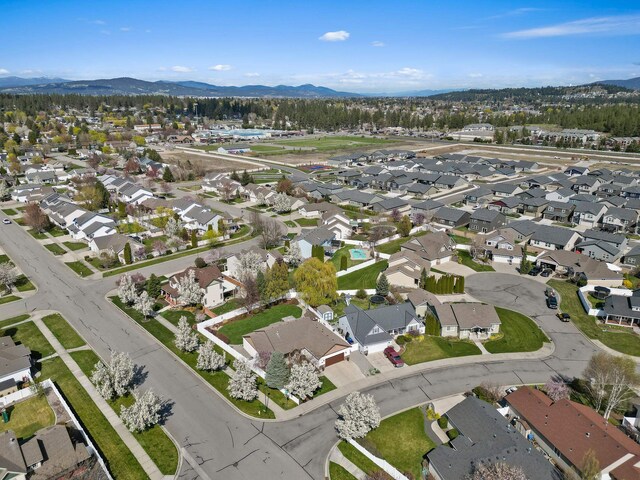 birds eye view of property featuring a mountain view and a residential view
