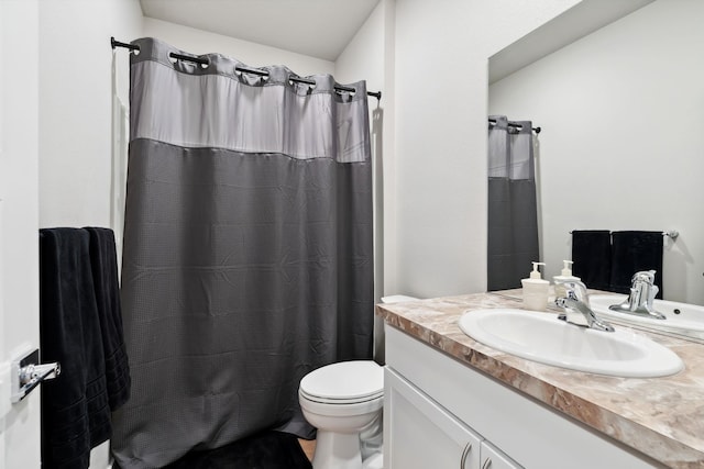 18706 E Flat Rock River Ave, Spokane Valley, WA 99016 - full bath featuring toilet, vanity, and a shower with shower curtain
