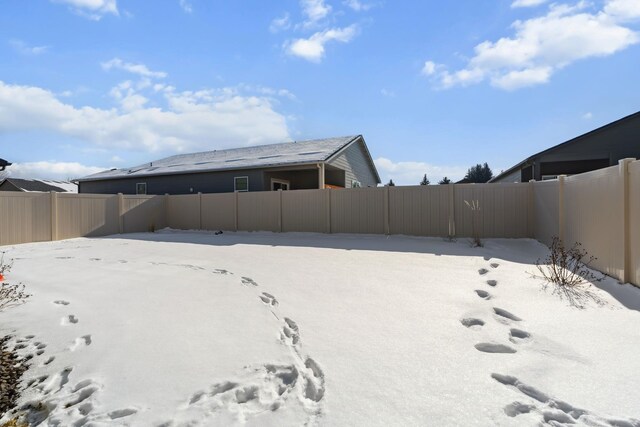 18706 E Flat Rock River Ave, Spokane Valley, WA 99016 - yard covered in snow featuring a fenced backyard