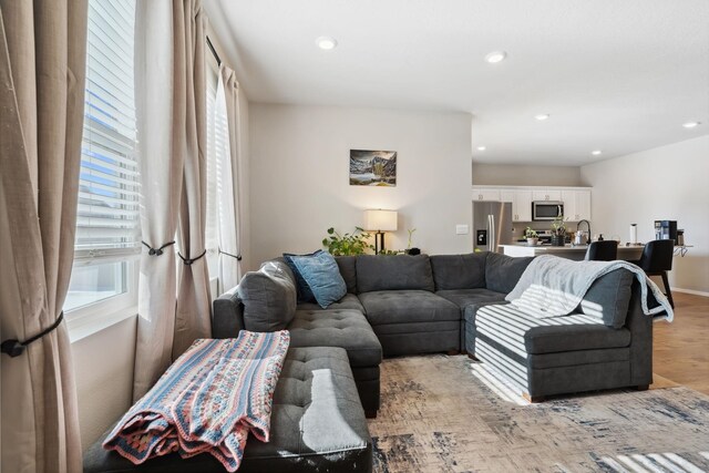 18706 E Flat Rock River Ave, Spokane Valley, WA 99016 - living room featuring light wood-style floors and recessed lighting