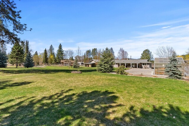view of yard with an exterior structure and an outdoor structure