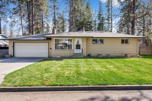 ranch-style house with a chimney, concrete driveway, crawl space, a front yard, and a garage