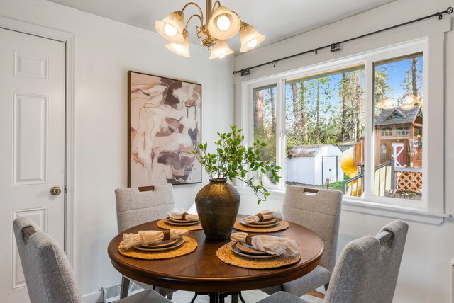 dining room with a notable chandelier