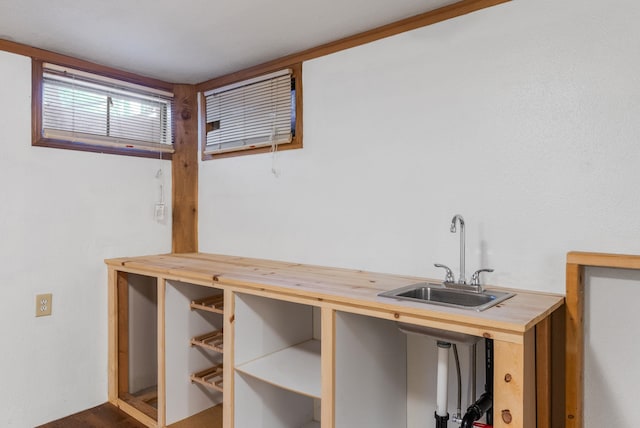 interior space with a sink and butcher block countertops