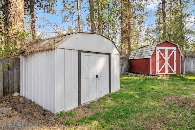 view of shed with fence