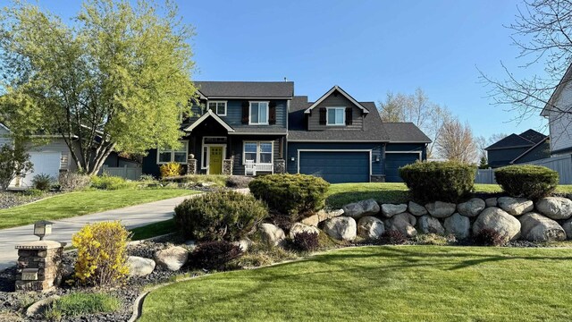craftsman house featuring a front yard