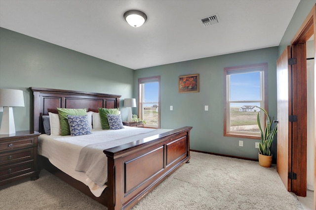 28222 N Wild Rose Ln, Davenport, WA 99122 - bedroom with baseboards, visible vents, and light colored carpet