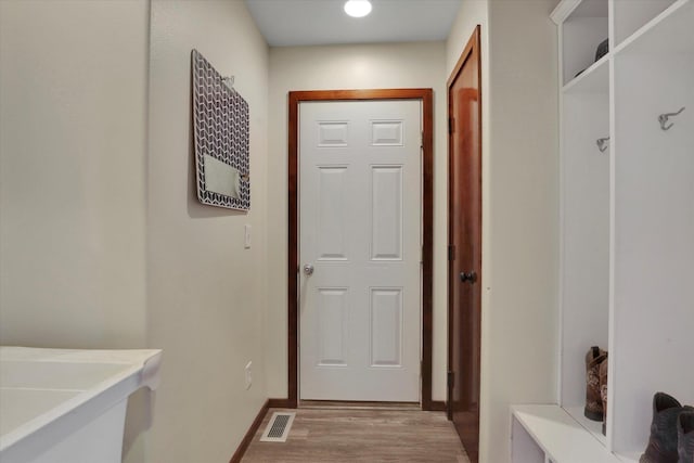 28222 N Wild Rose Ln, Davenport, WA 99122 - doorway to outside featuring baseboards, visible vents, and light wood-style flooring