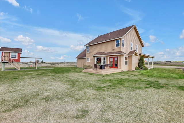 28222 N Wild Rose Ln, Davenport, WA 99122 - rear view of house featuring a lawn, a deck, a shingled roof, and french doors