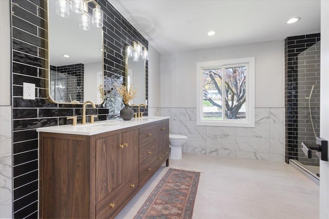 full bath with a wainscoted wall, a sink, double vanity, and tile walls