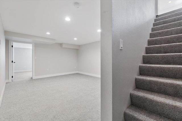 staircase featuring baseboards, recessed lighting, and carpet flooring