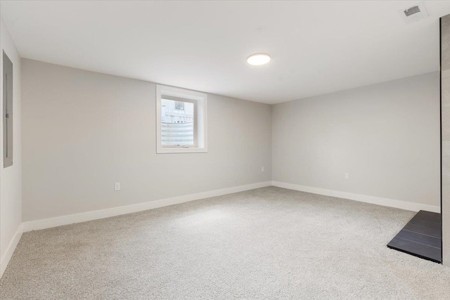 below grade area featuring baseboards and carpet