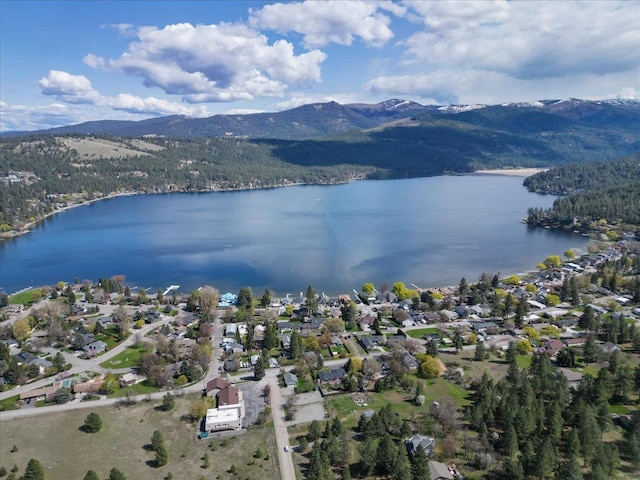 bird's eye view featuring a water and mountain view