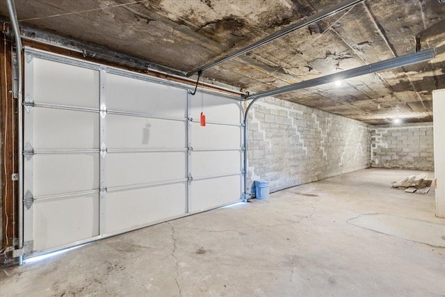 garage with concrete block wall